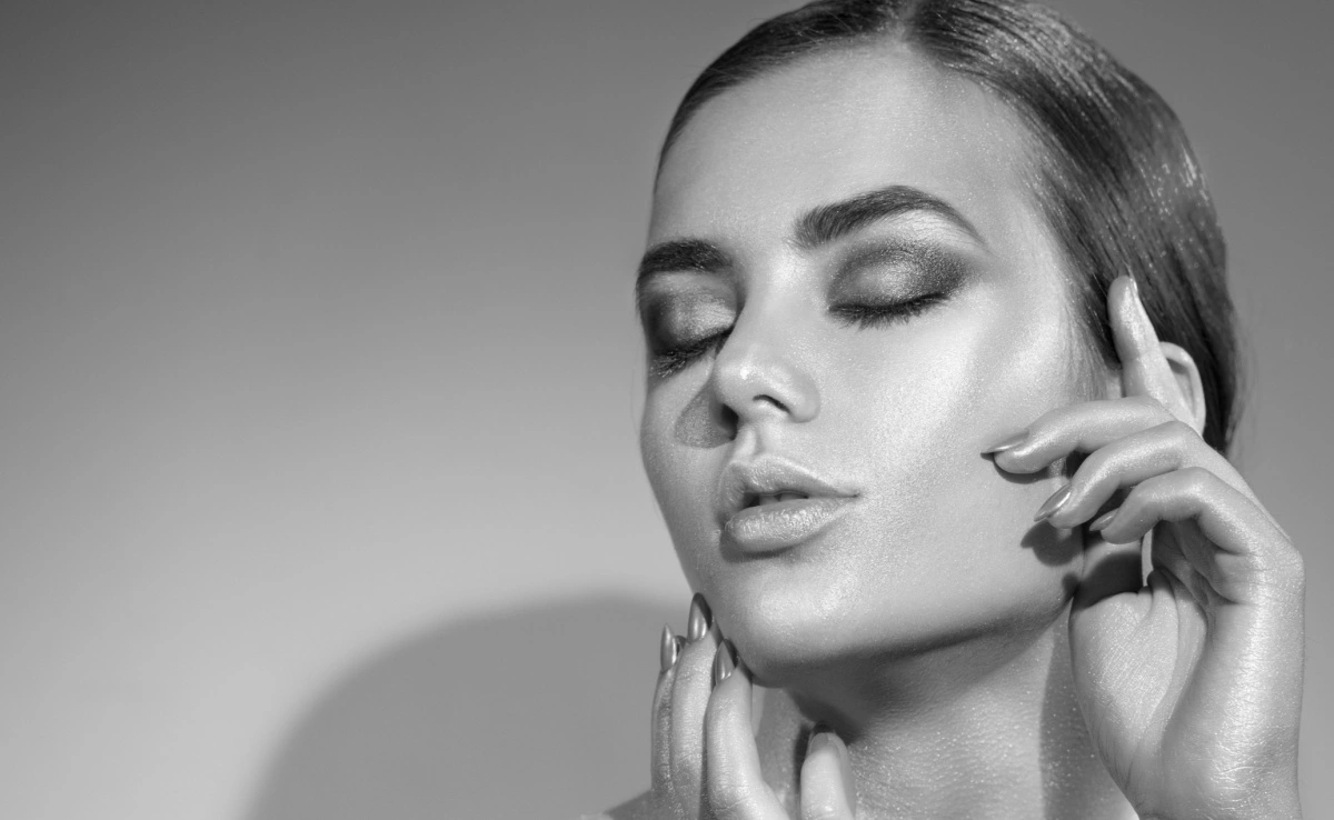youthful woman with glowing skin and full lips