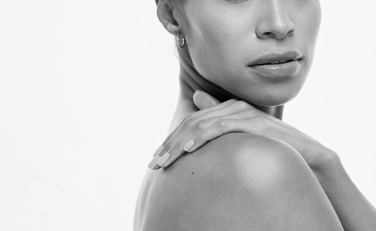 Hand of female touching skin in self love or self care for soft, smooth or healthy treatment