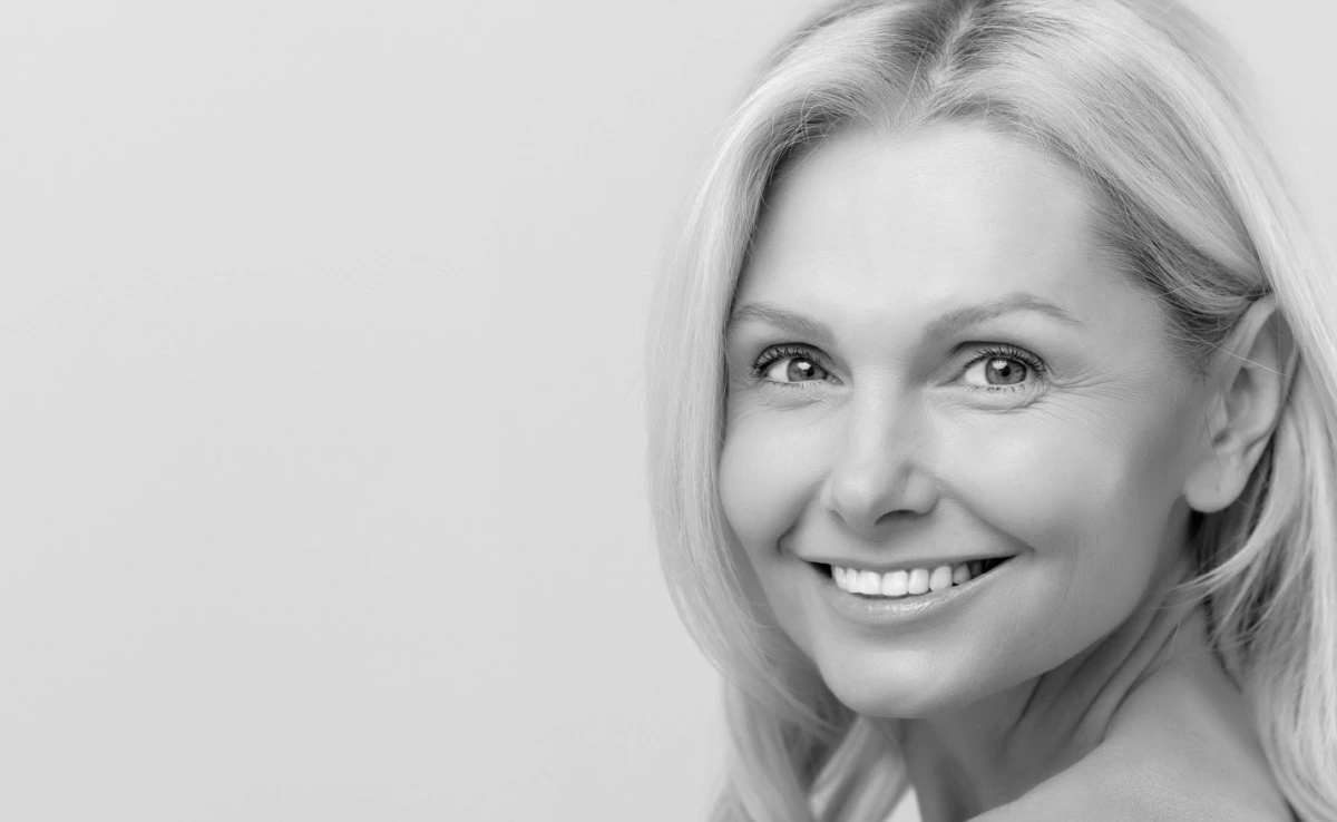 mature blonde woman with youthful glowing skin