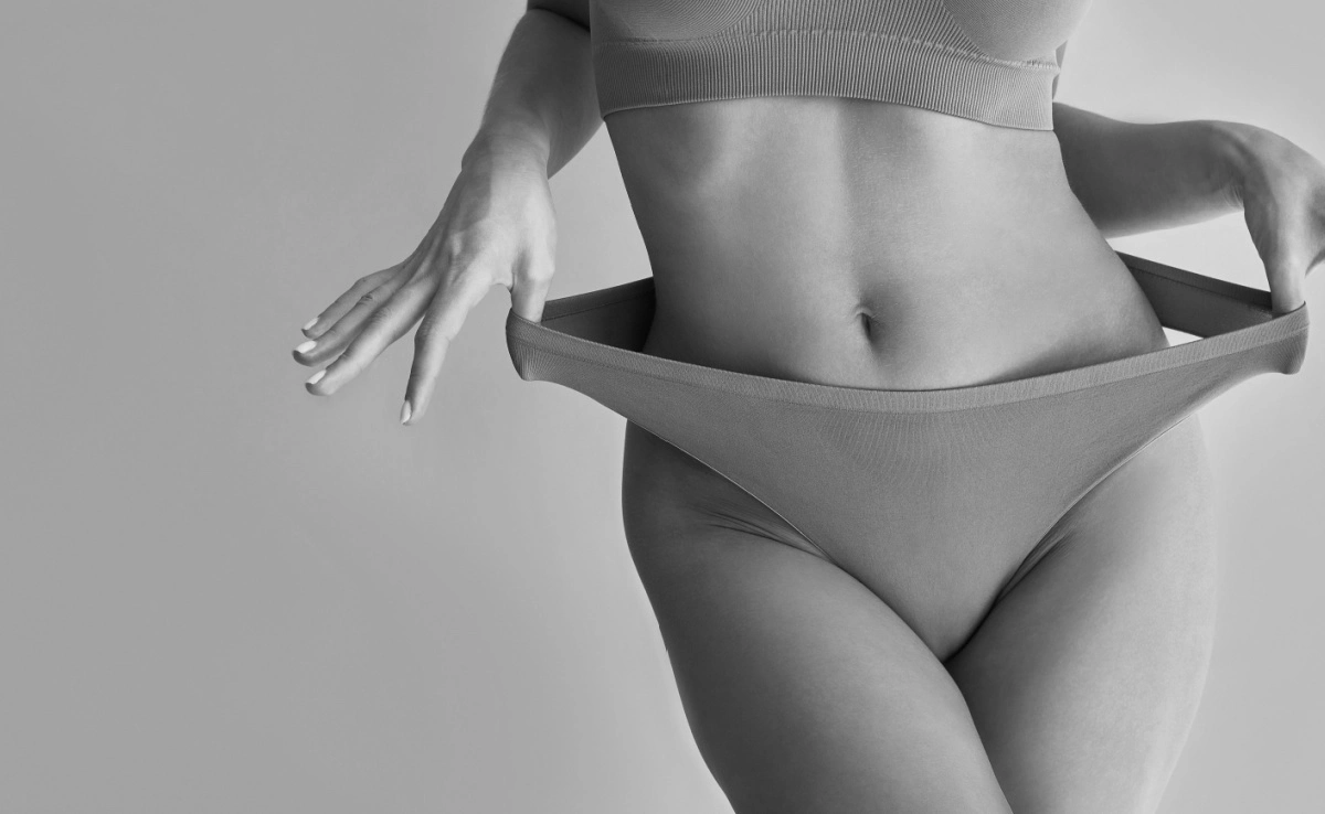A sporty tanned woman in her underwear